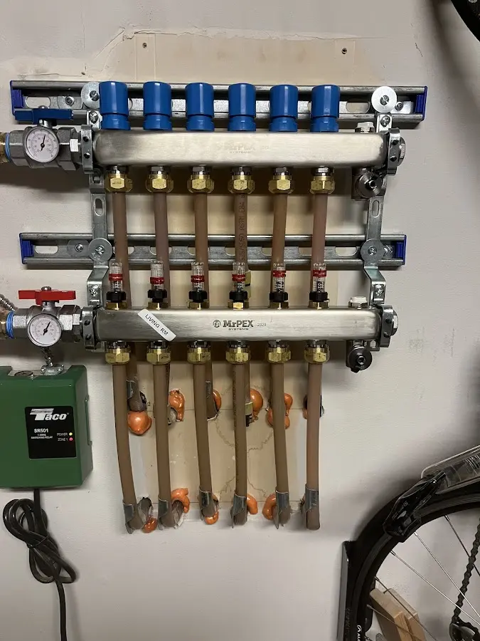 Plumber performing Gas Leak Detection at a residential property in Cullowhee